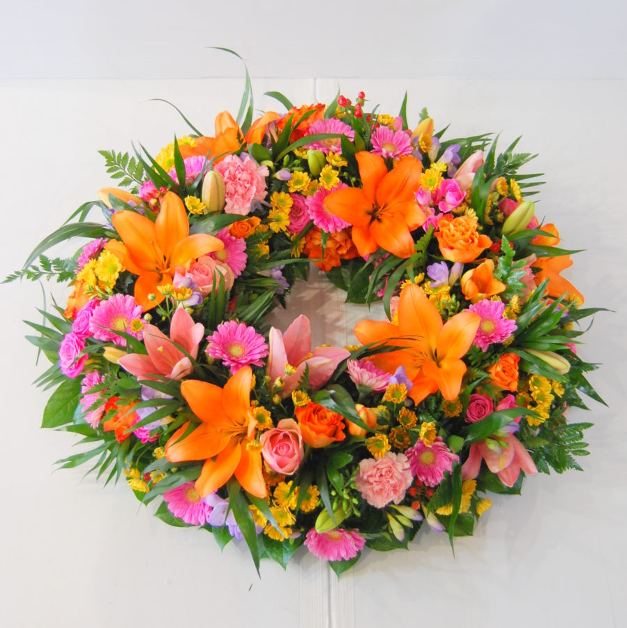 Couronne de fleurs deuil orange rose