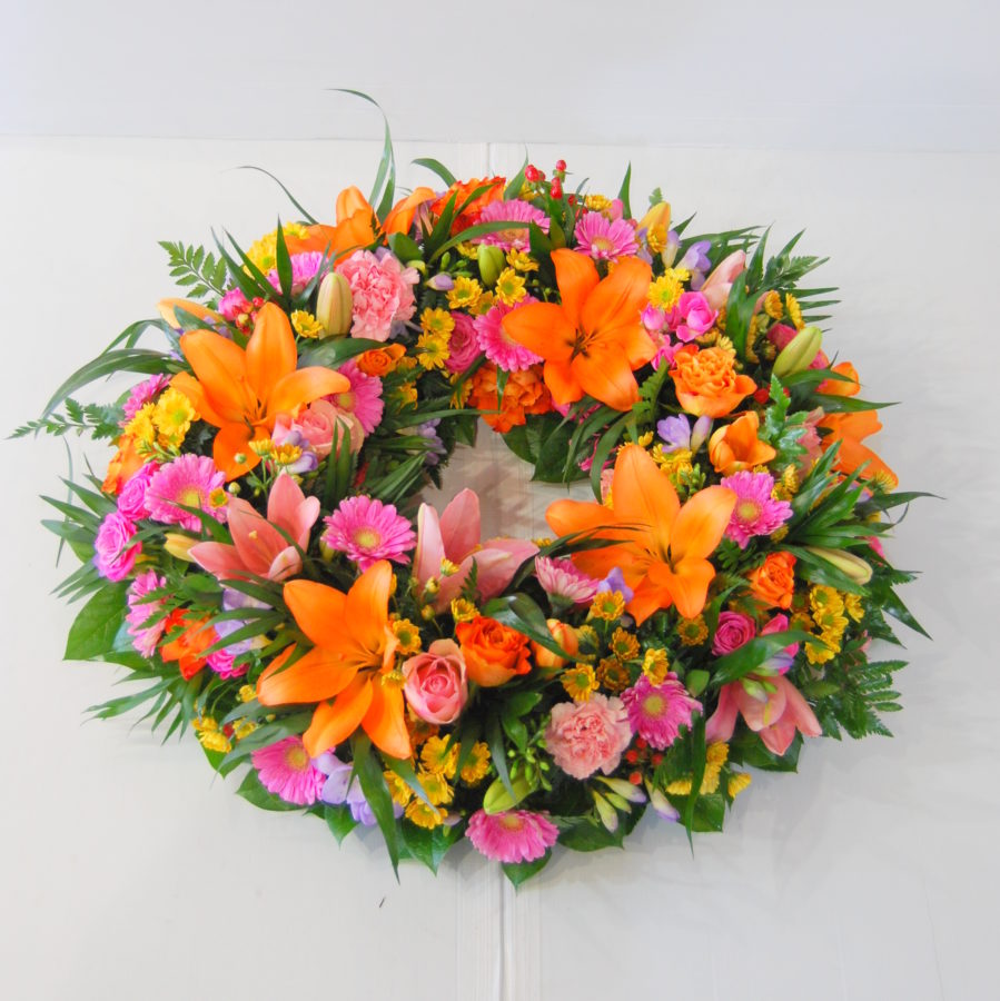 COURONNE DE FLEURS DEUIL ORANGE/ROSE - Livraison Toulouse - Calypso Fleurs